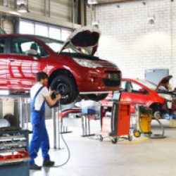 car on a vertical vehicle lift